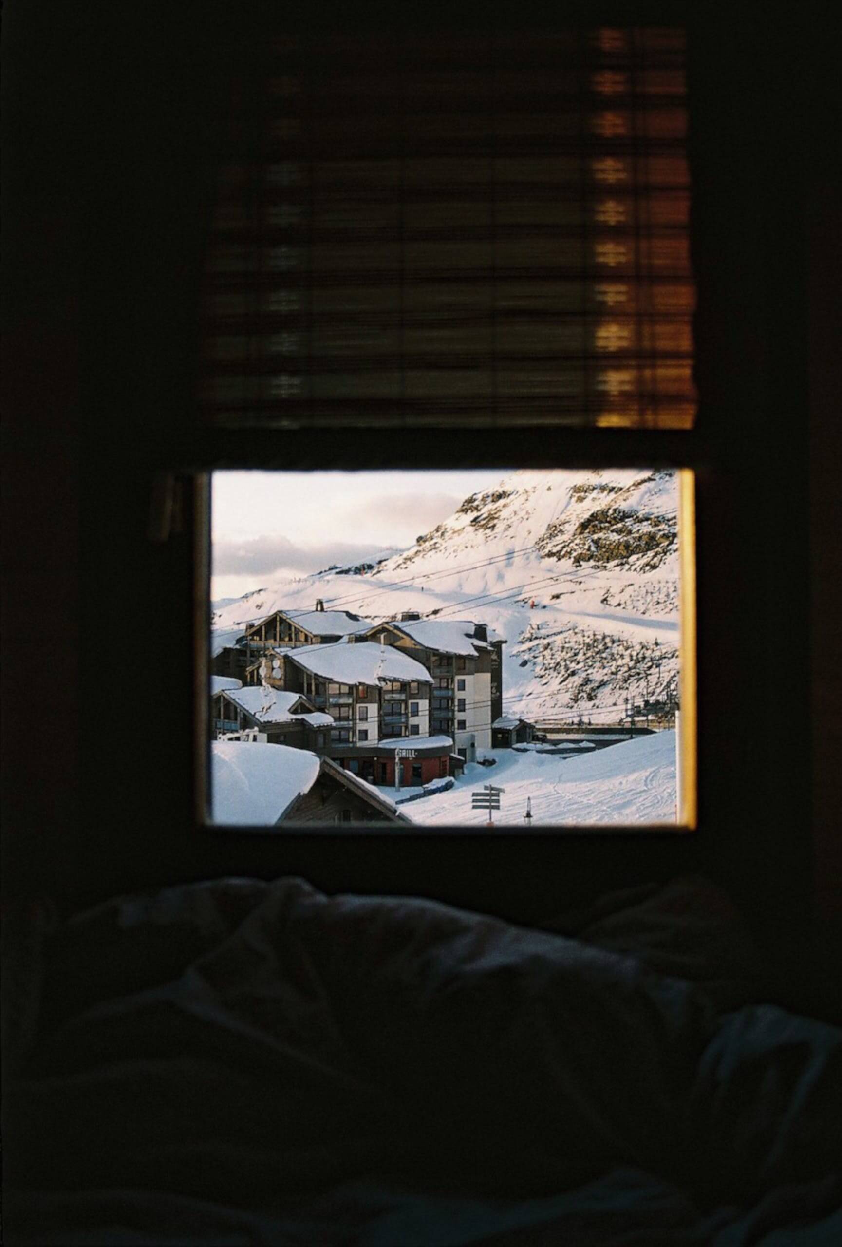 photo of snowy town through a window